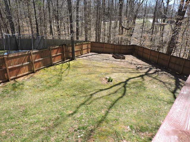 2701 Hidden Ridge Court Clarksville, TN 37043 - Photo 21 of 25 a bed sitting in a backyard