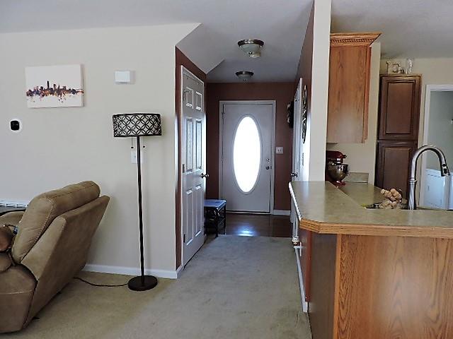2701 Hidden Ridge Court Clarksville, TN 37043 - Photo 3 of 25 a room with a mirror and a wooden floor