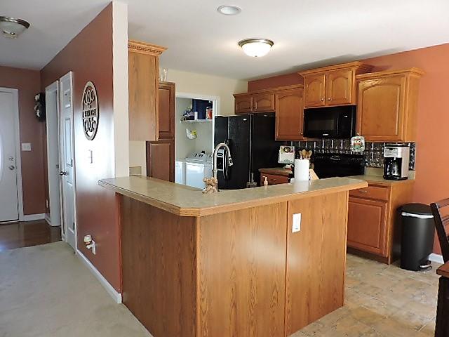 2701 Hidden Ridge Court Clarksville, TN 37043 - Photo 5 of 25 a kitchen with stainless steel appliances a refrigerator and microwave