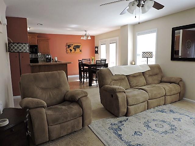2701 Hidden Ridge Court Clarksville, TN 37043 - Photo 8 of 25 a living room with furniture and a chandelier