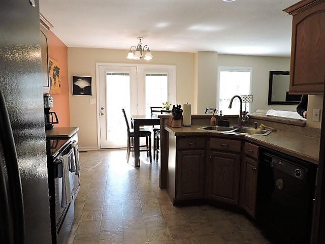 2701 Hidden Ridge Court Clarksville, TN 37043 - Photo 9 of 25 a kitchen with stainless steel appliances granite countertop a sink refrigerator and cabinets