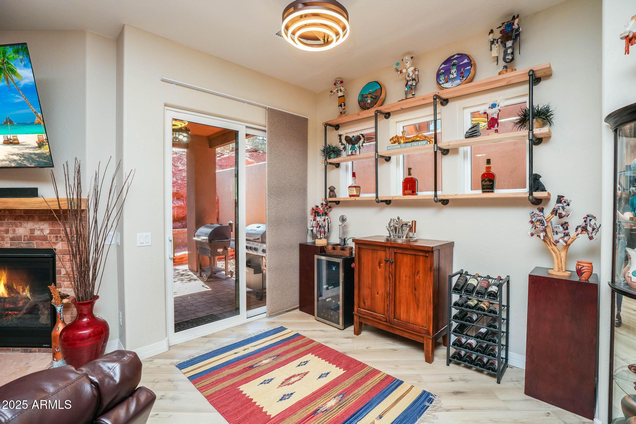 3835 Portofino Way Sedona, AZ 86336 - Photo 14 of 48 a living room with furniture and a fireplace