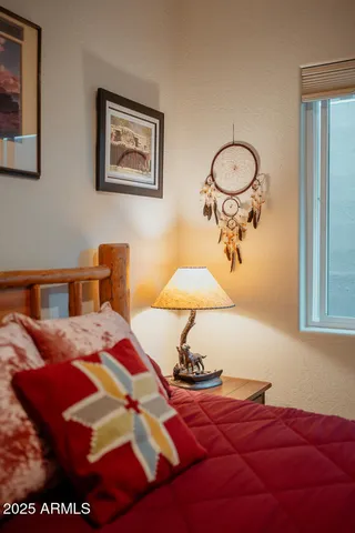 a bedroom with a bed and a couch