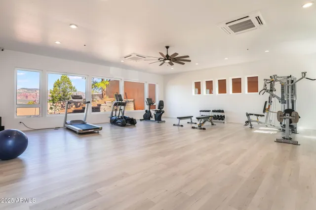 a view of a livingroom with furniture water view and a large window