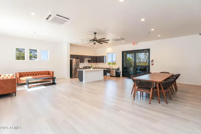 a view of a dining room with furniture and a livingroom