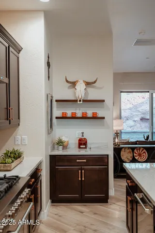 a stove top oven sitting inside of a kitchen