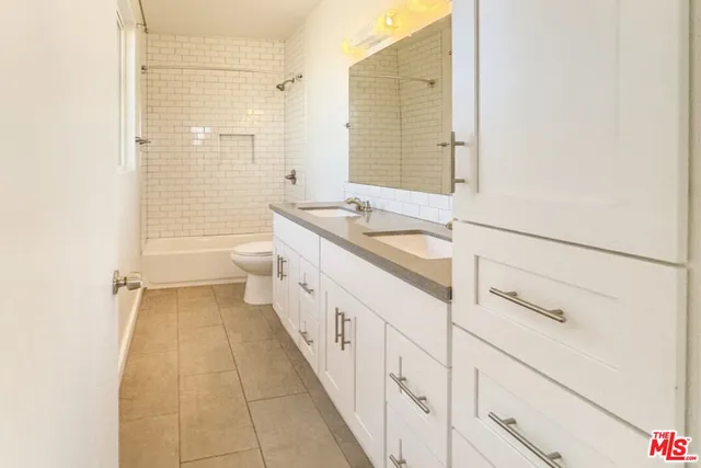 an empty room with wooden floor and outer view