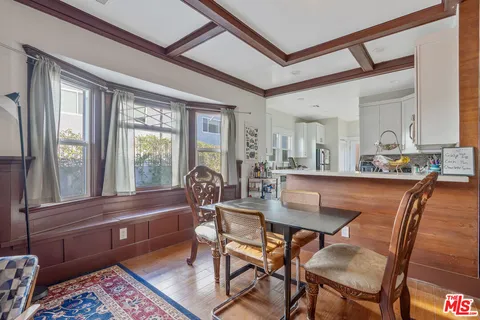 a kitchen with stainless steel appliances a stove a sink a microwave and a refrigerator