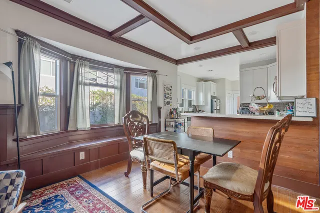 a kitchen with stainless steel appliances a stove a sink a microwave and a refrigerator