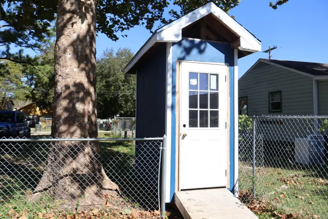 a view of a house with a small yard