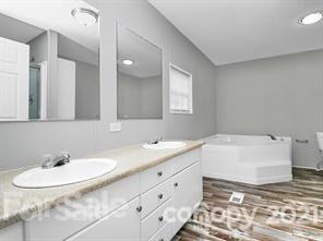 143 Francis Road Blacksburg, SC 29702 - Photo 6 of 15 a bathroom with a sink and a mirror