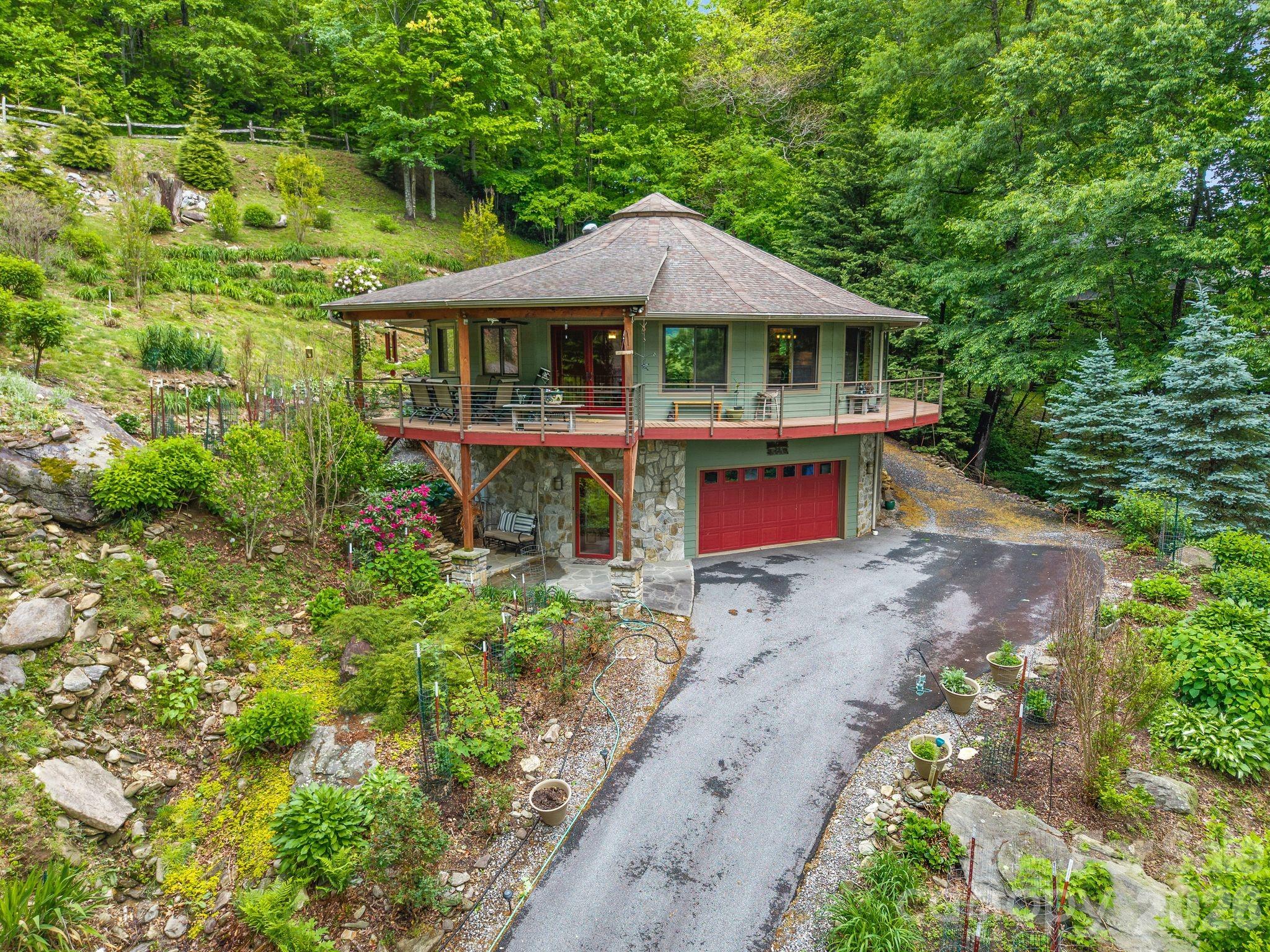 140 Slim Ridge Maggie Valley, NC 28751 - Photo 1 of 33 a front view of a house with a yard