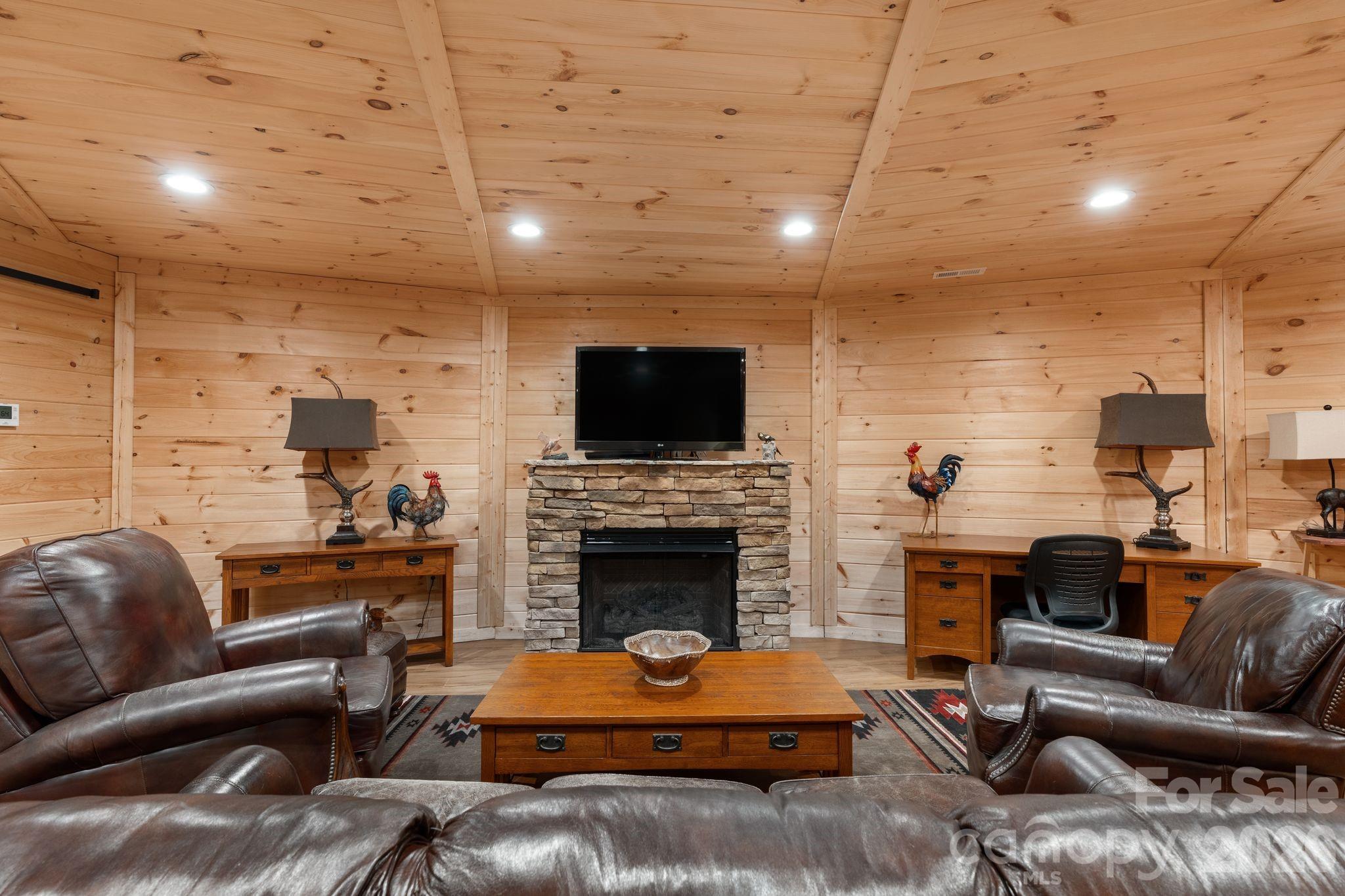 140 Slim Ridge Maggie Valley, NC 28751 - Photo 17 of 33 a living room with furniture and a fireplace