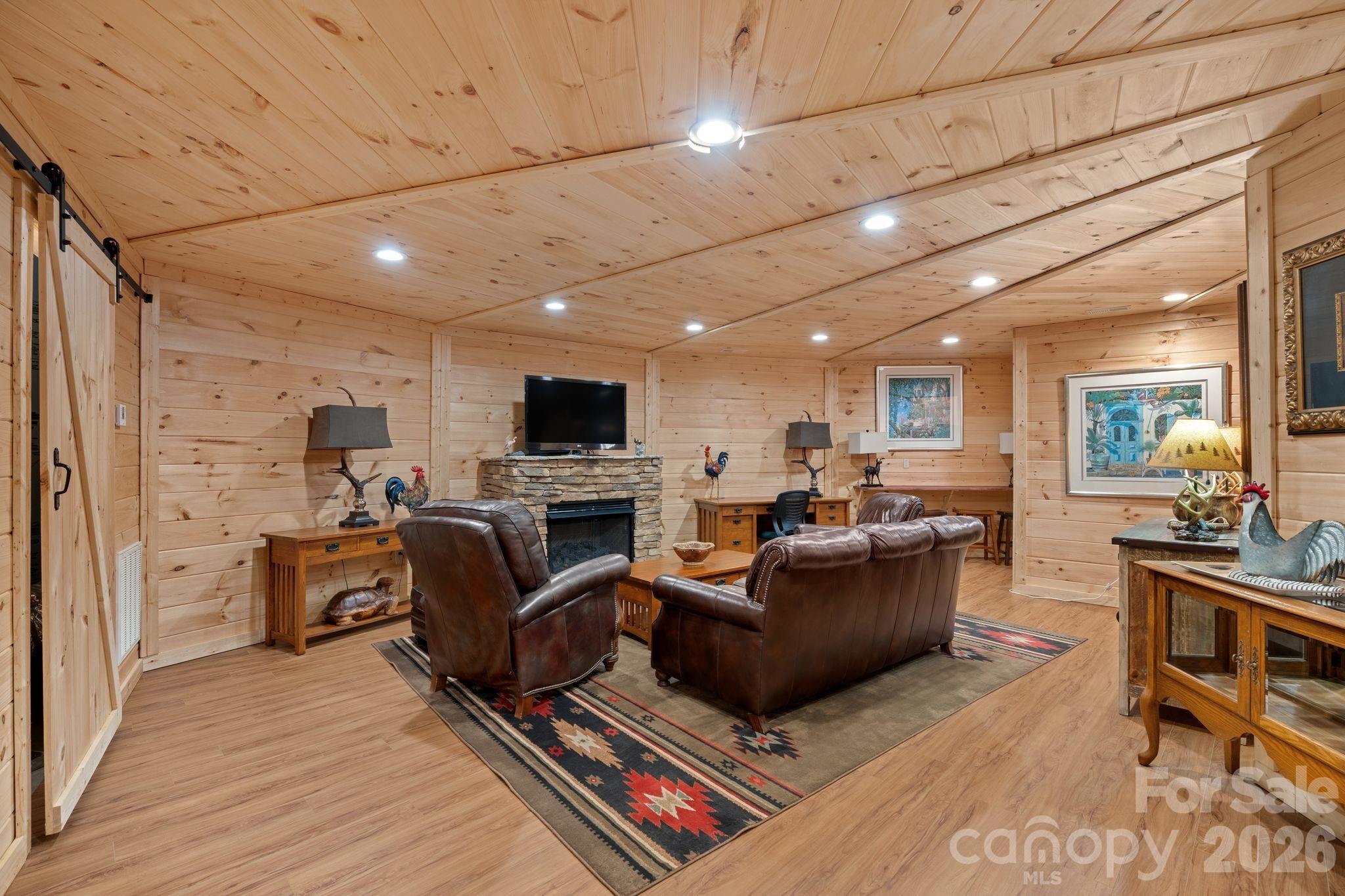 140 Slim Ridge Maggie Valley, NC 28751 - Photo 18 of 33 a living room with furniture and a flat screen tv