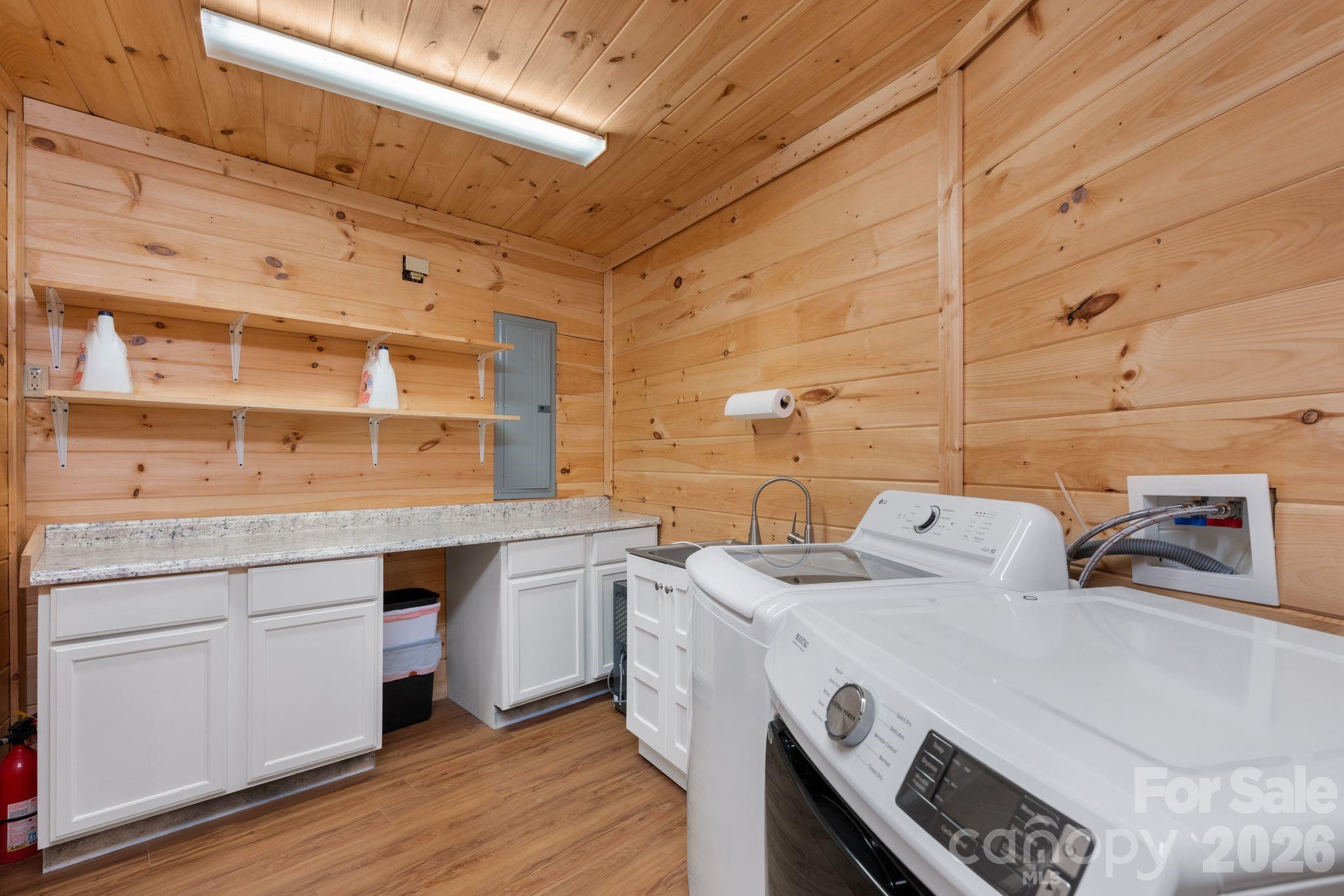 140 Slim Ridge Maggie Valley, NC 28751 - Photo 21 of 33 a utility room with a sink a washer and dryer