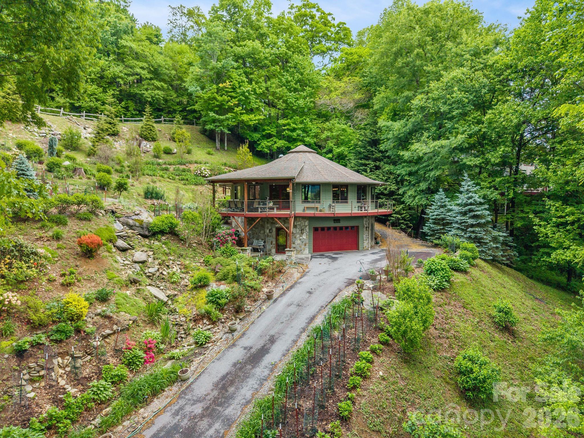 140 Slim Ridge Maggie Valley, NC 28751 - Photo 29 of 33 a view of a house with a yard and garden