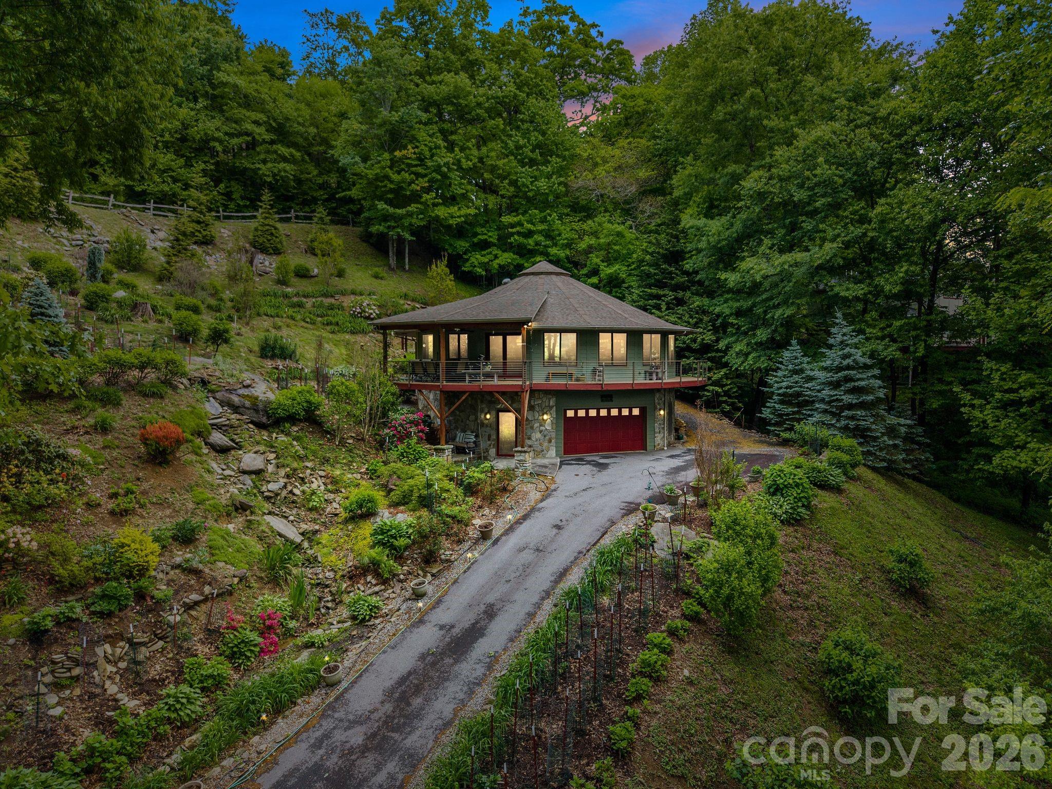 140 Slim Ridge Maggie Valley, NC 28751 - Photo 30 of 33 a view of a house with a yard and garden