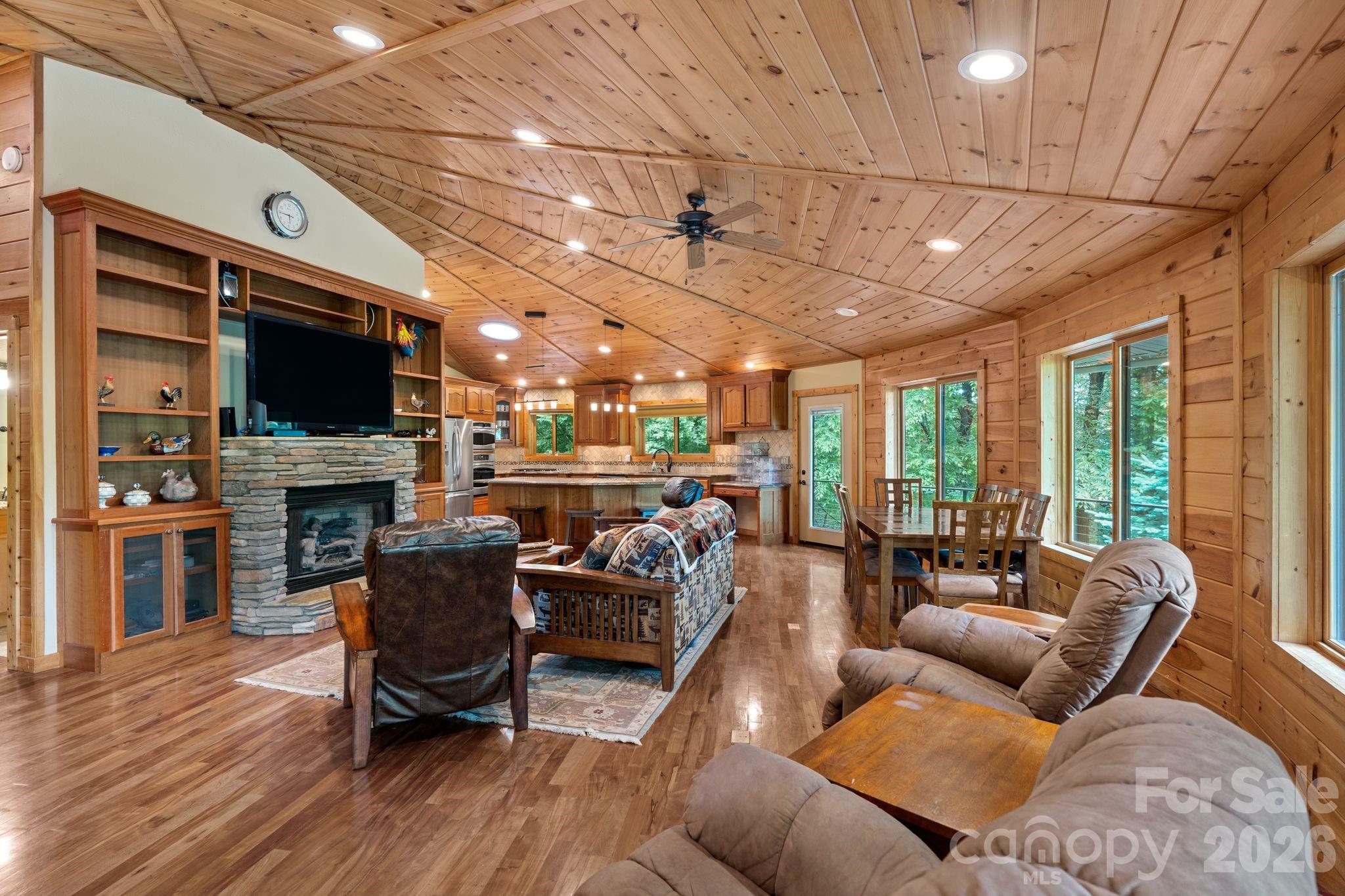 140 Slim Ridge Maggie Valley, NC 28751 - Photo 4 of 33 a living room with fireplace furniture and a flat screen tv