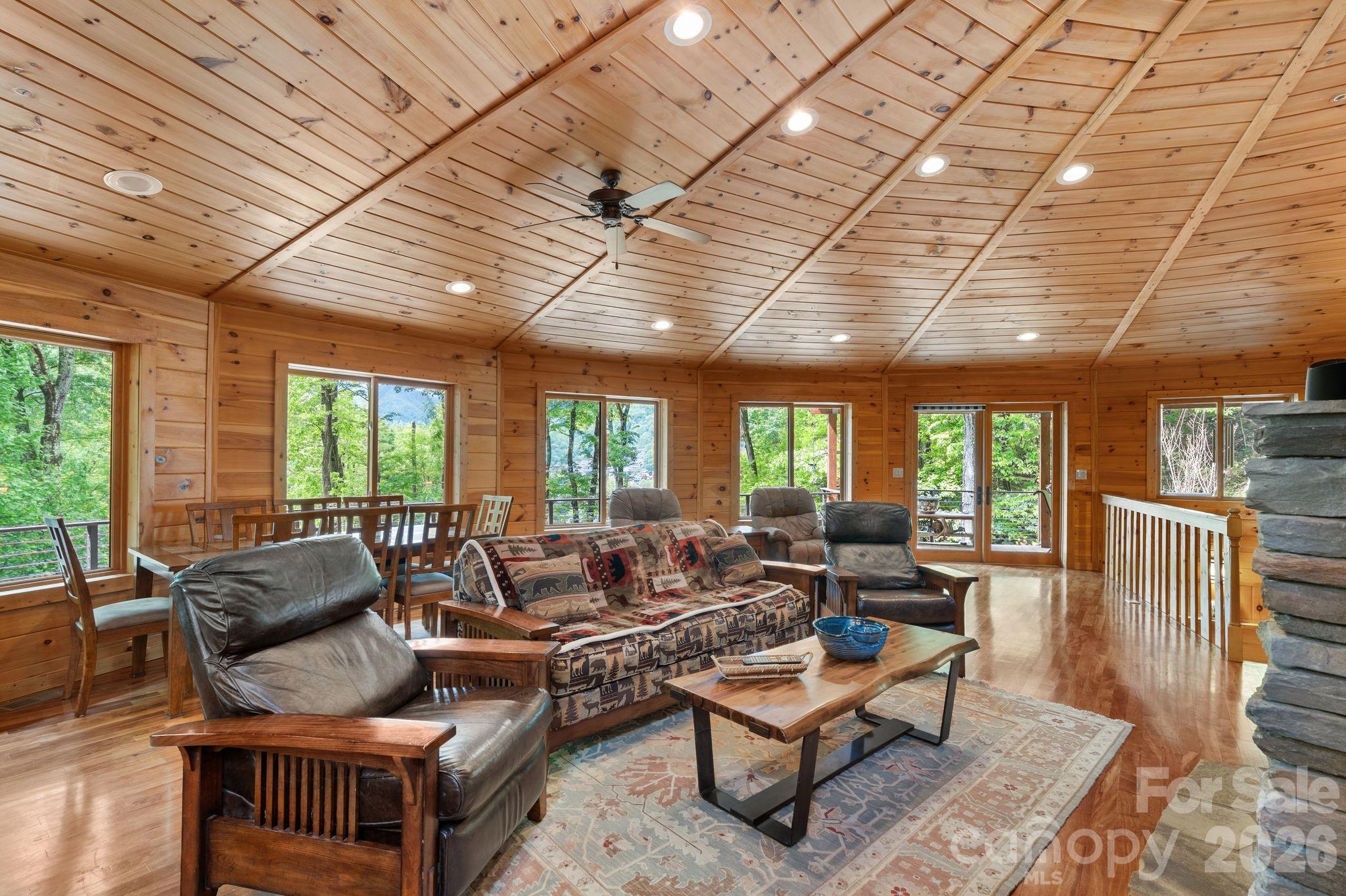 140 Slim Ridge Maggie Valley, NC 28751 - Photo 6 of 33 a living room with furniture and a large window