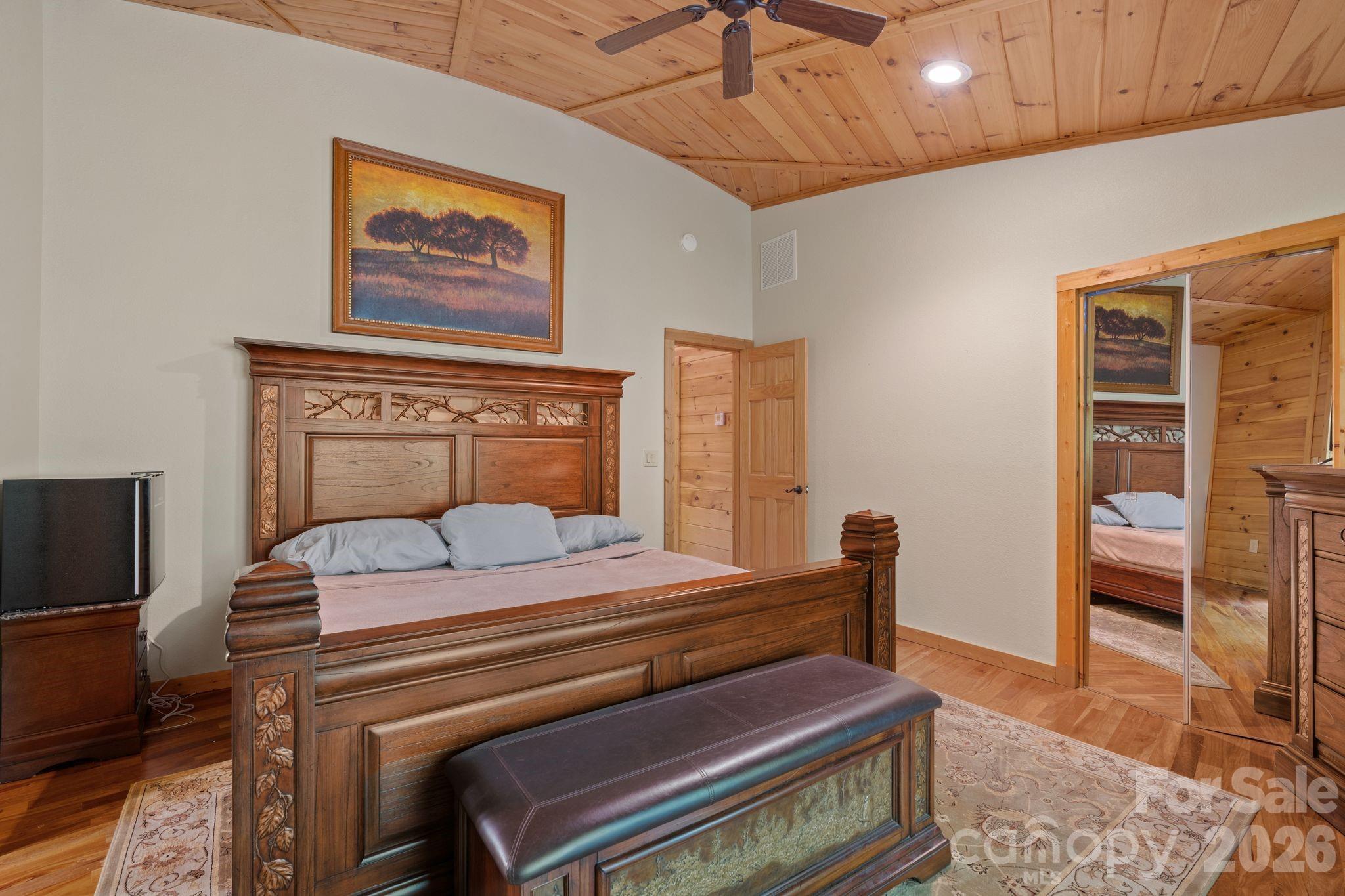 140 Slim Ridge Maggie Valley, NC 28751 - Photo 8 of 33 a bedroom with a bed and furniture