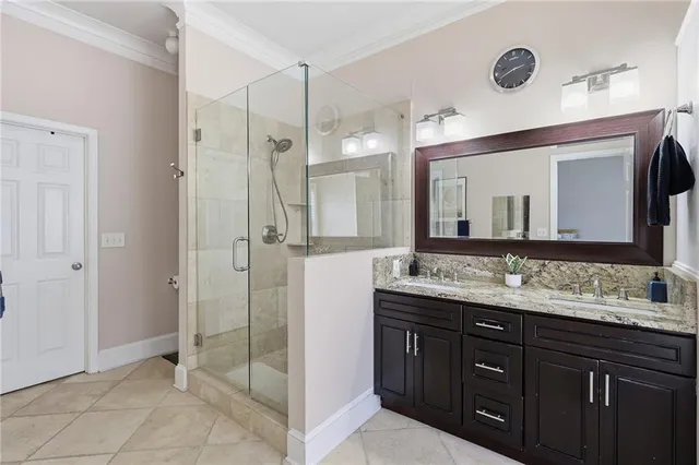 a bathroom with a double vanity sink mirror and double