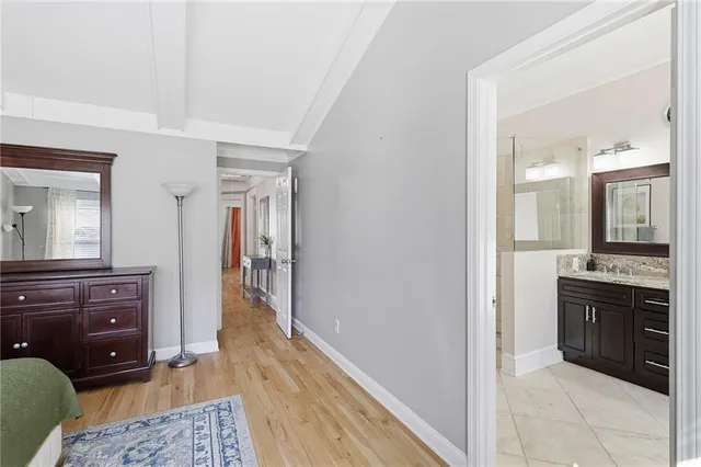 a room with a dresser and a mirror