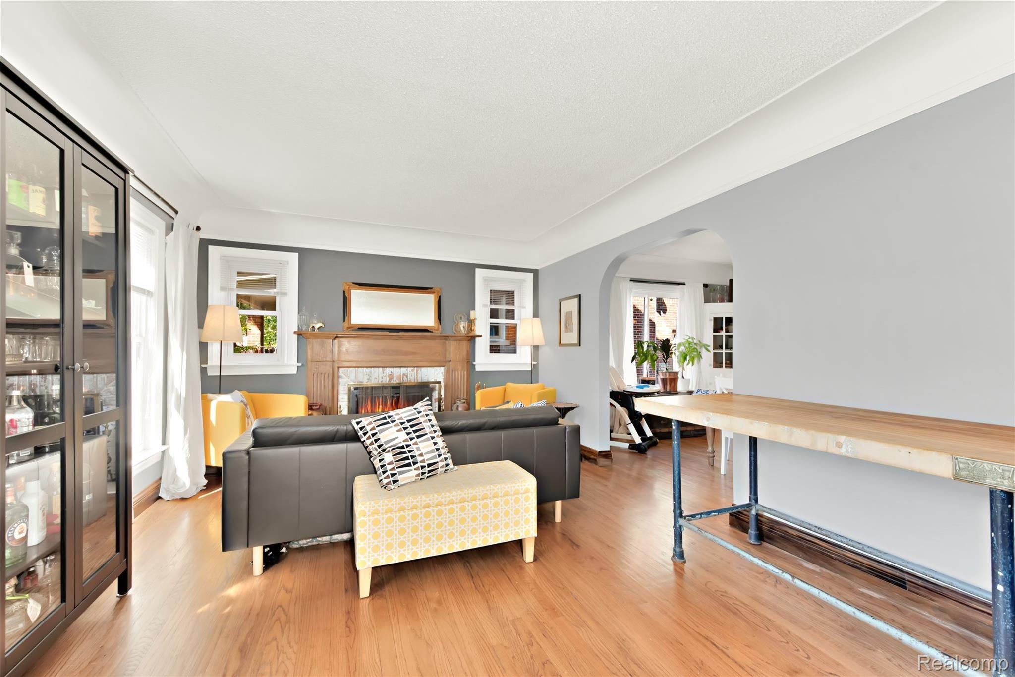 5730 Audubon Road Detroit, MI 48224 - Photo 5 of 46 Living room with natural fireplace and beautiful hardwood floors