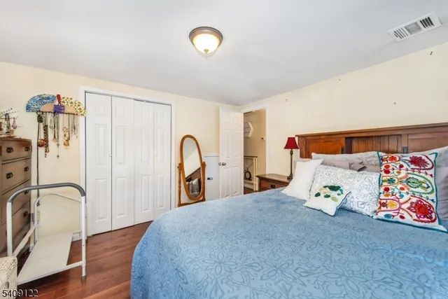 a bedroom with a bed and a cabinets