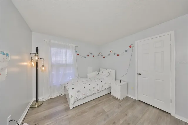 a view of a bedroom with baby bed