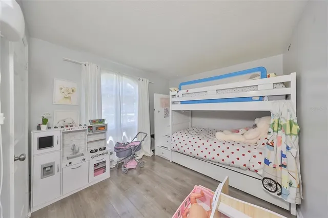 a bedroom with a bed and cabinets