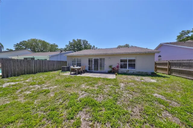 a front view of a house with a garden and yard