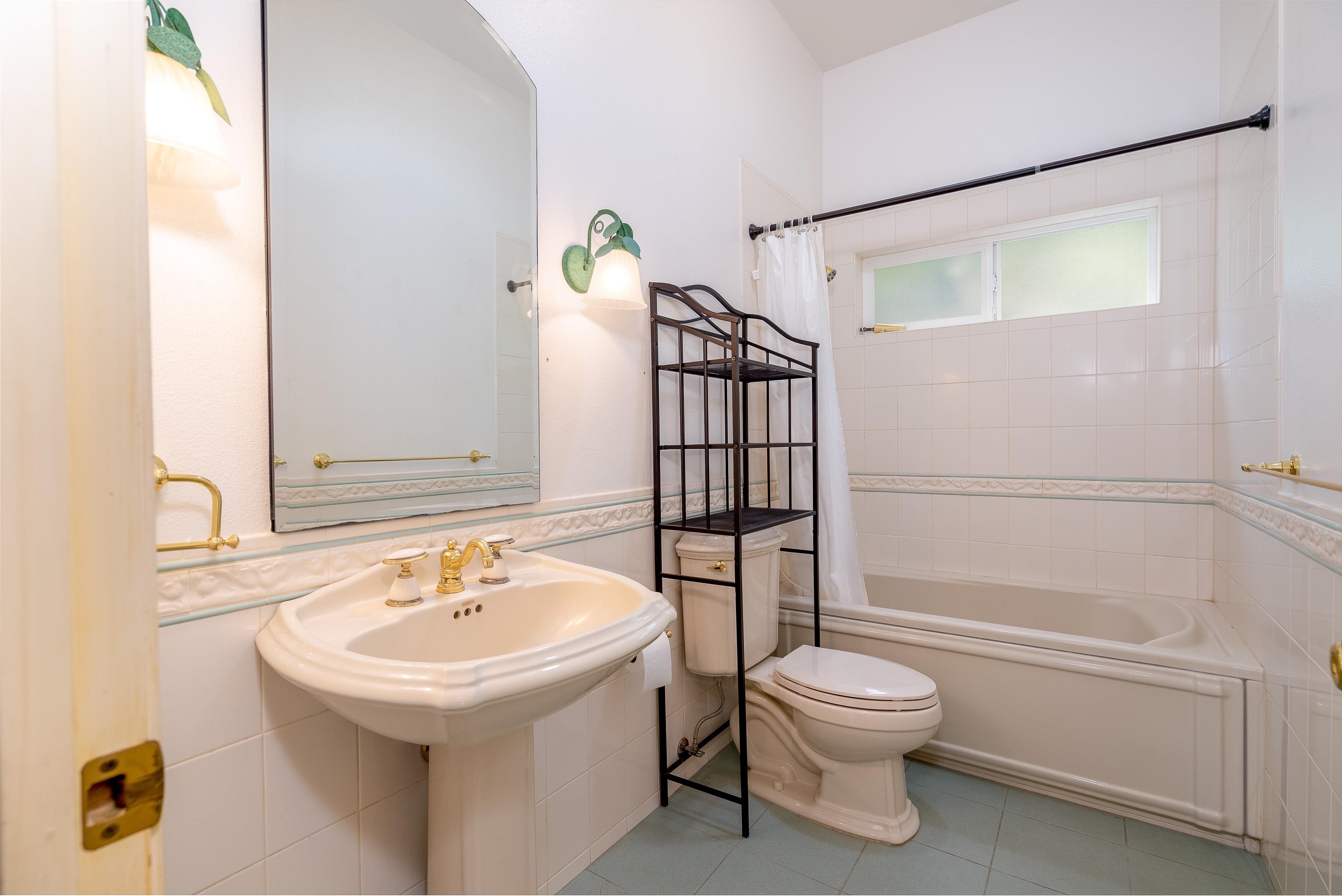 216 Kamakoi Loop Kihei, HI 96753 - Photo 17 of 30 a bathroom with a sink toilet and shower