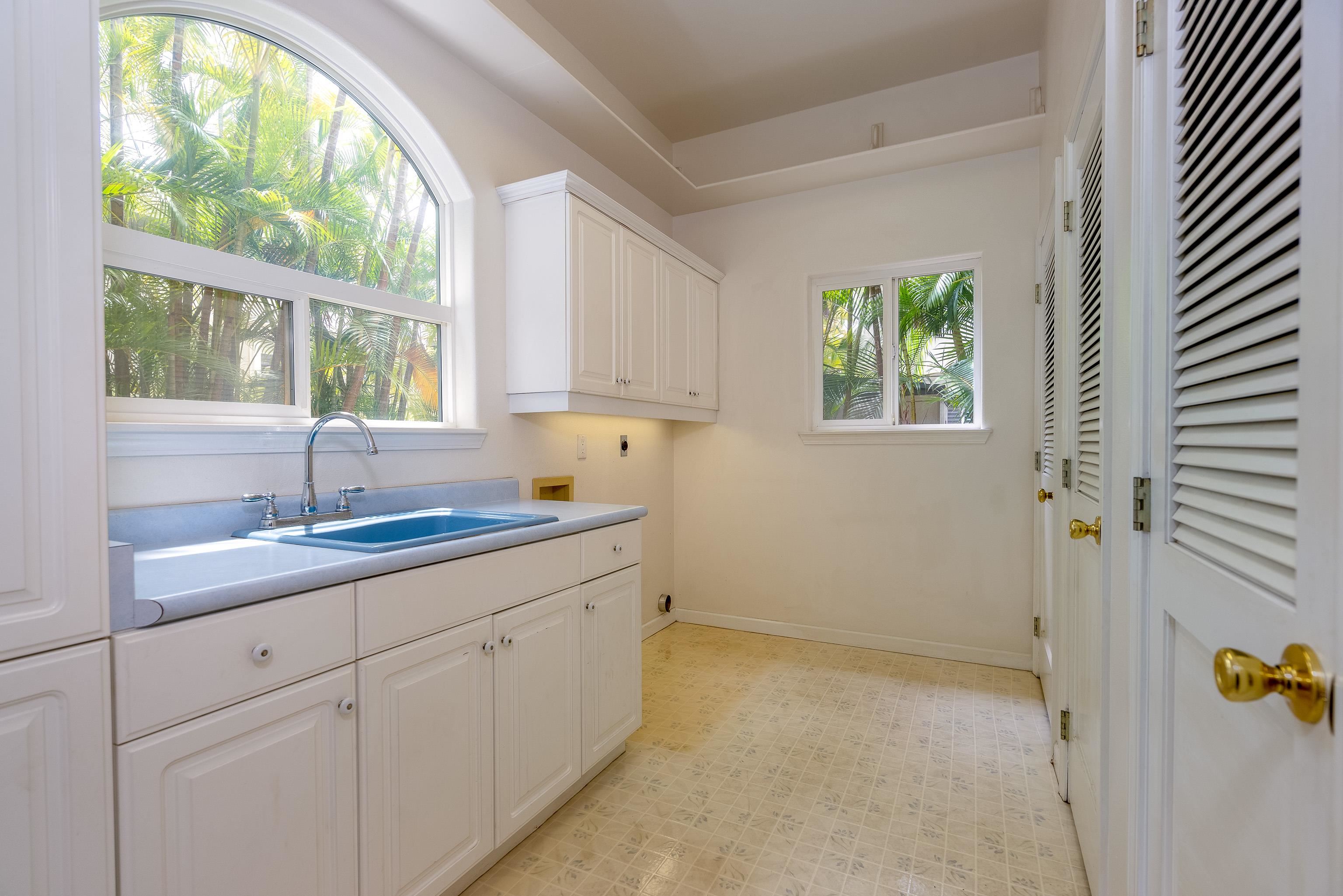 216 Kamakoi Loop Kihei, HI 96753 - Photo 18 of 30 a kitchen with a sink and cabinets