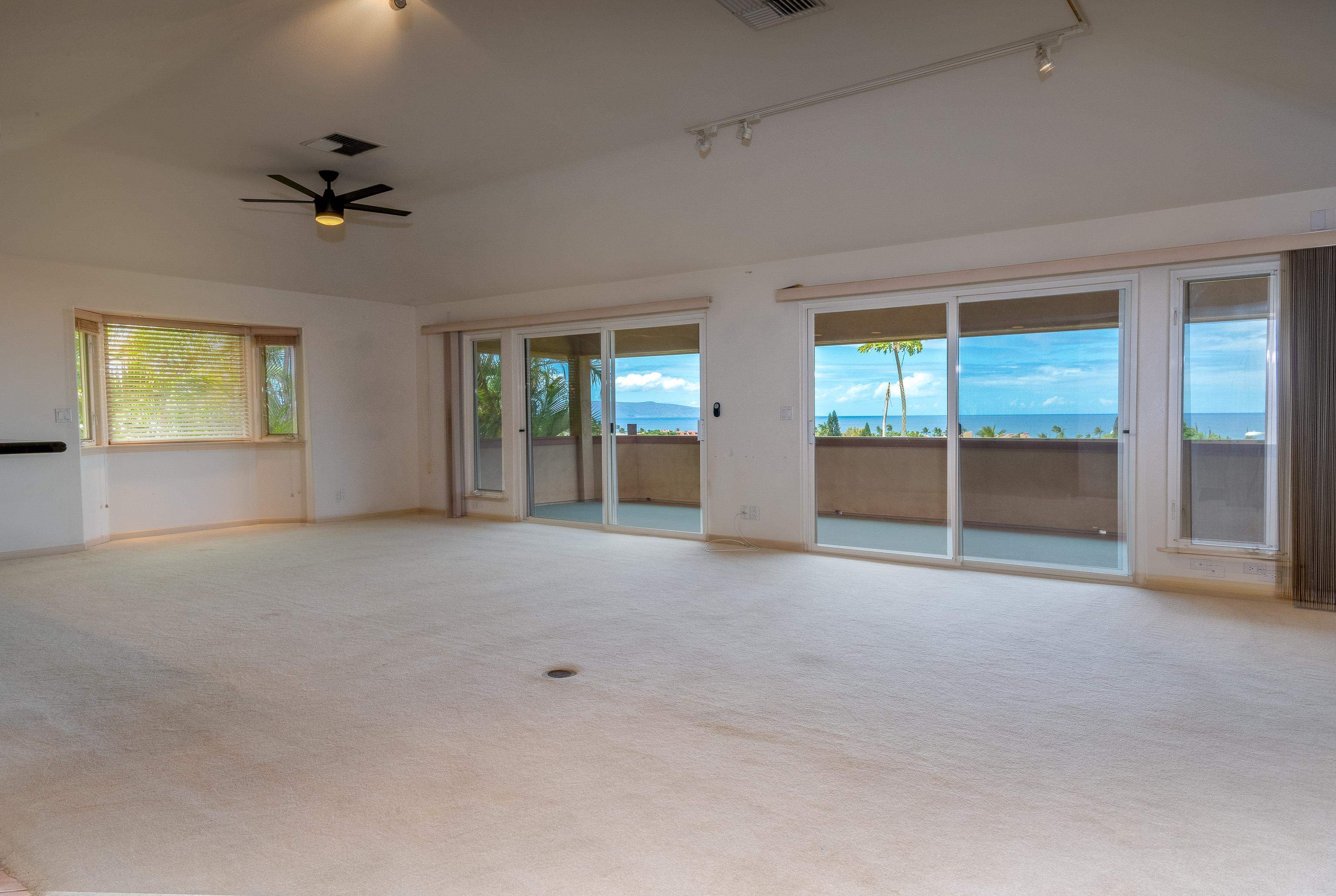 216 Kamakoi Loop Kihei, HI 96753 - Photo 19 of 30 an empty room with windows