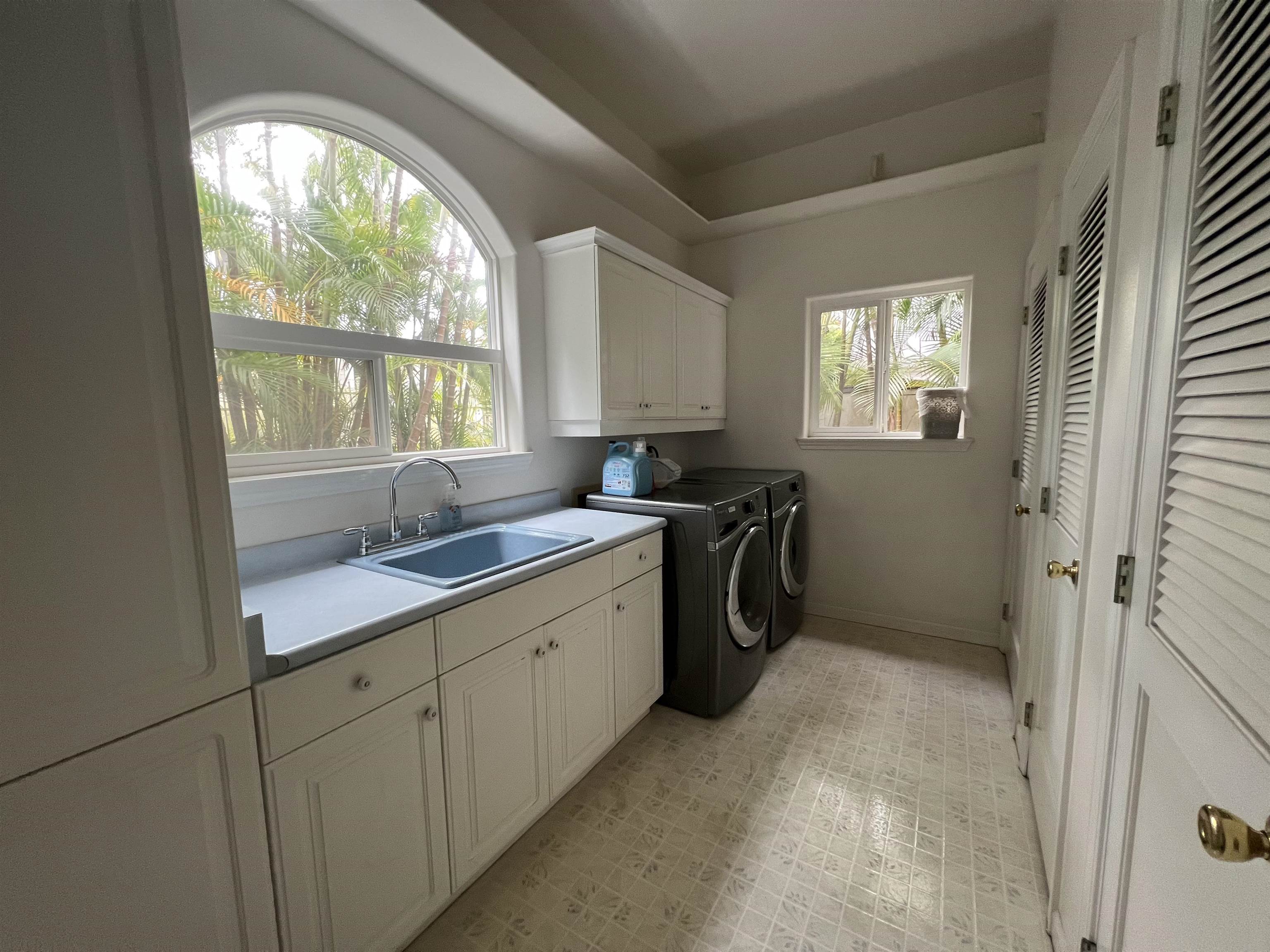 216 Kamakoi Loop Kihei, HI 96753 - Photo 20 of 30 a kitchen with a sink cabinets appliances and a window