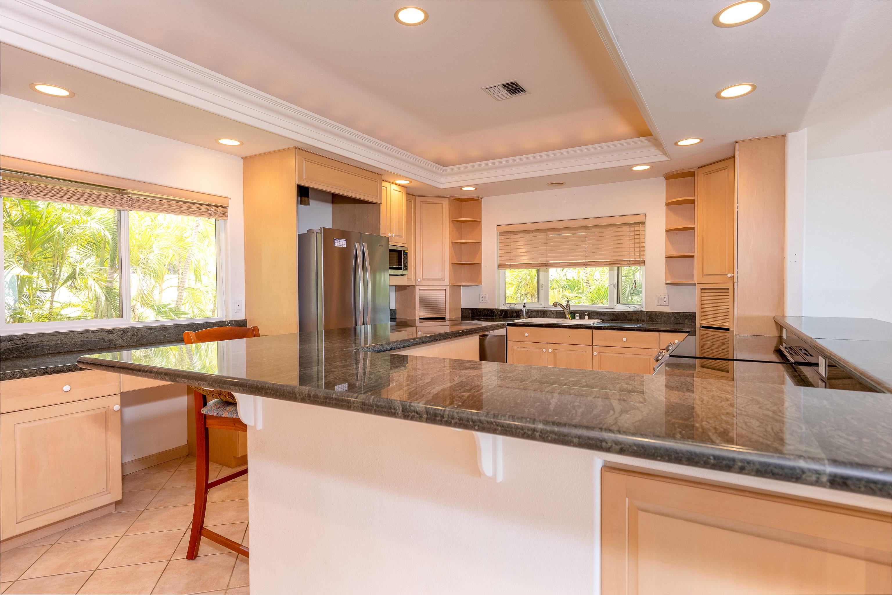 216 Kamakoi Loop Kihei, HI 96753 - Photo 22 of 30 a view of a kitchen with a large window and a counter top space