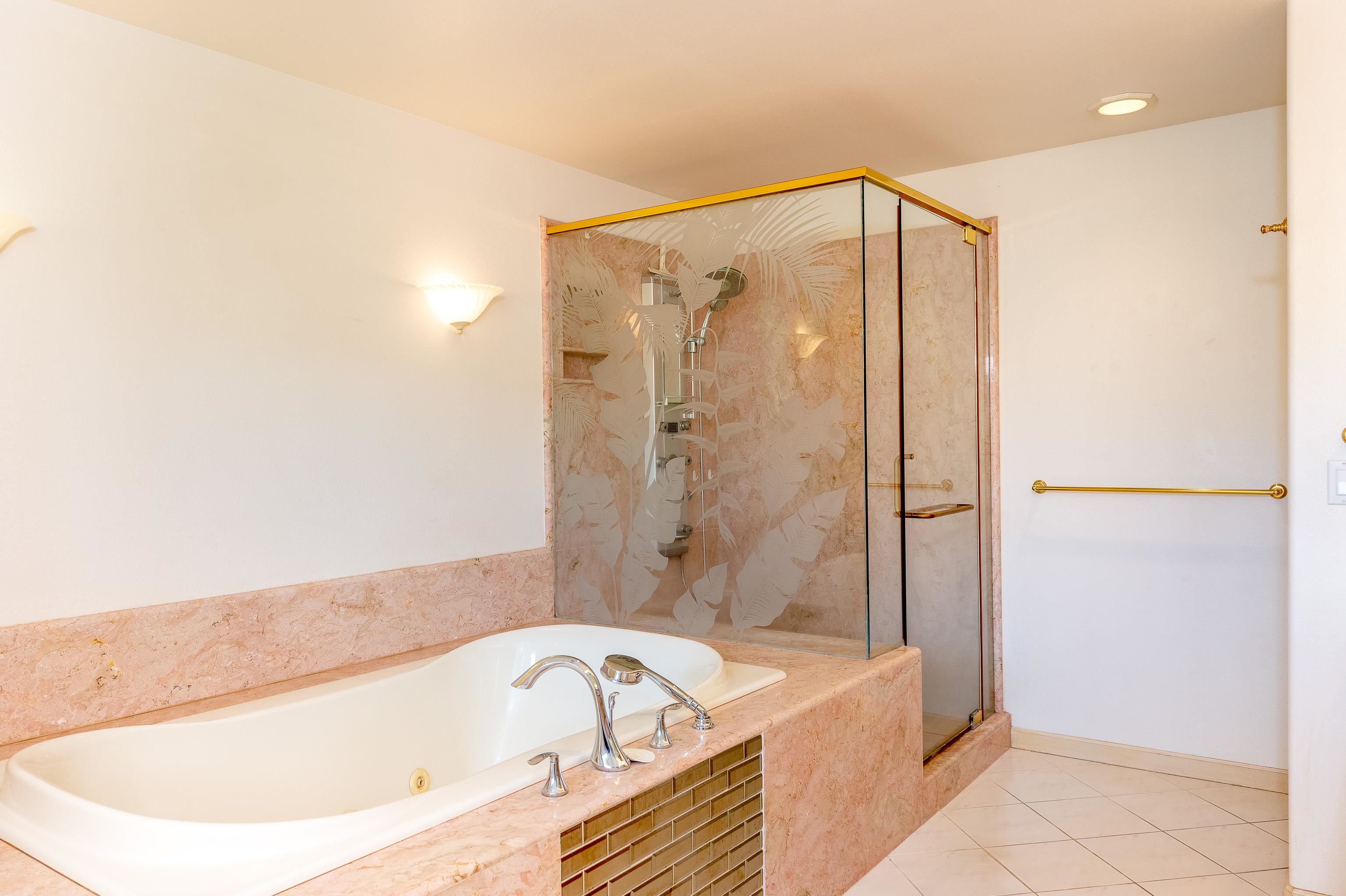 216 Kamakoi Loop Kihei, HI 96753 - Photo 27 of 30 a bathroom with a bathtub and a shower