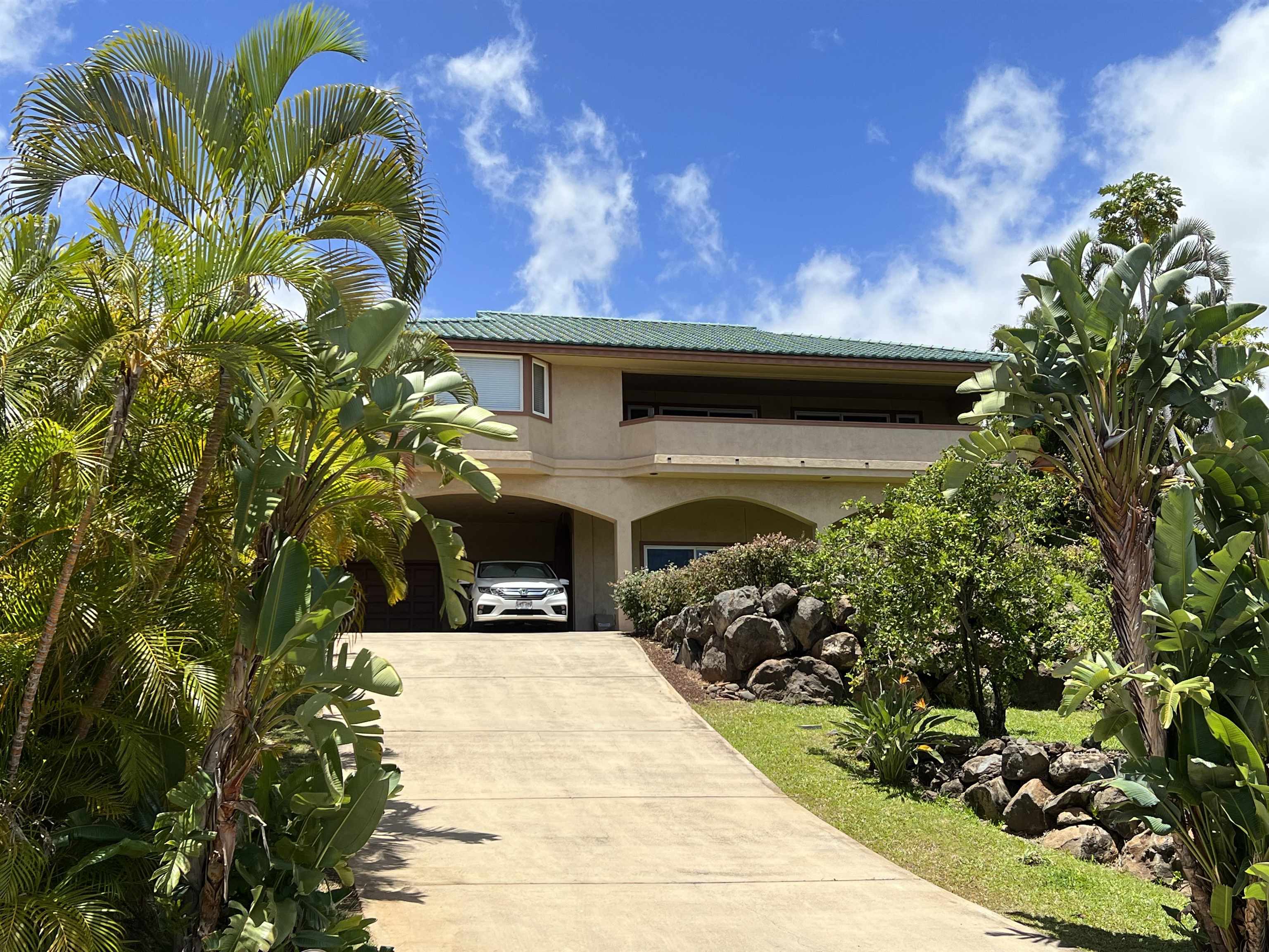 216 Kamakoi Loop Kihei, HI 96753 - Photo 3 of 30 a front view of a house with a yard