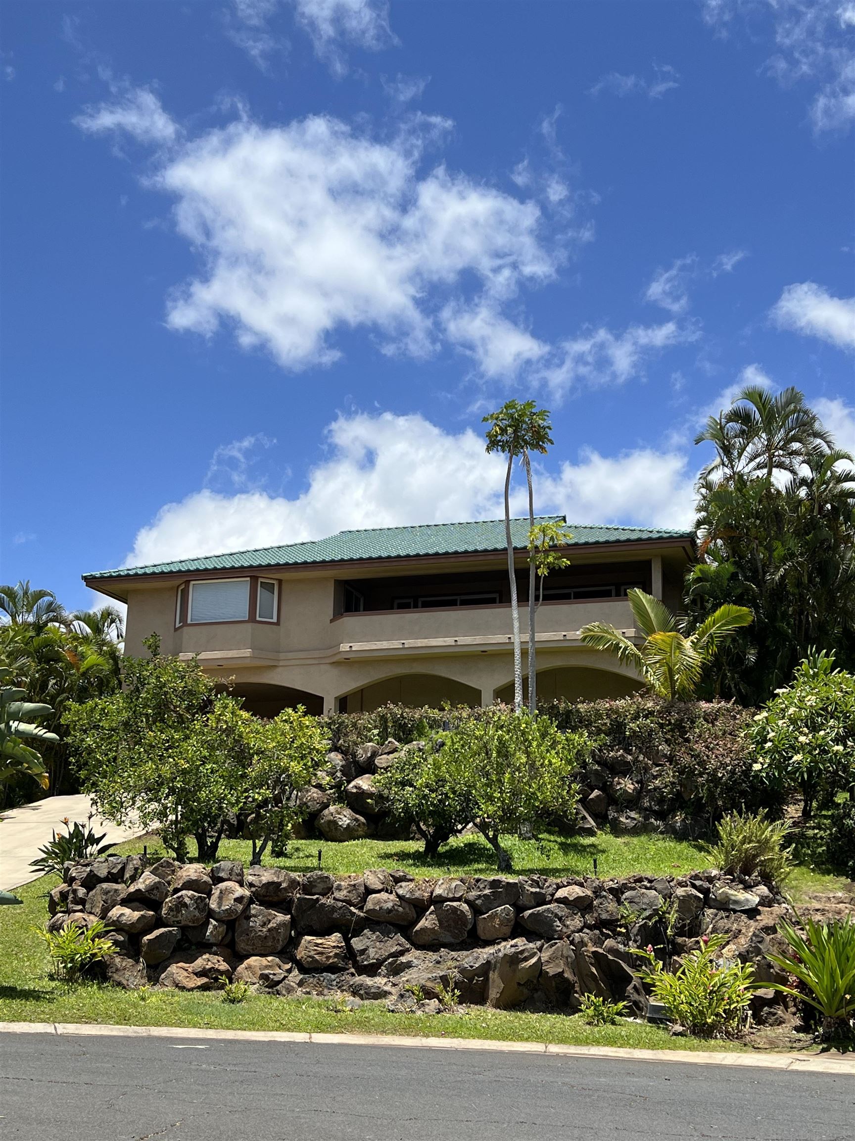 216 Kamakoi Loop Kihei, HI 96753 - Photo 4 of 30 a view of a house with a yard and potted plants
