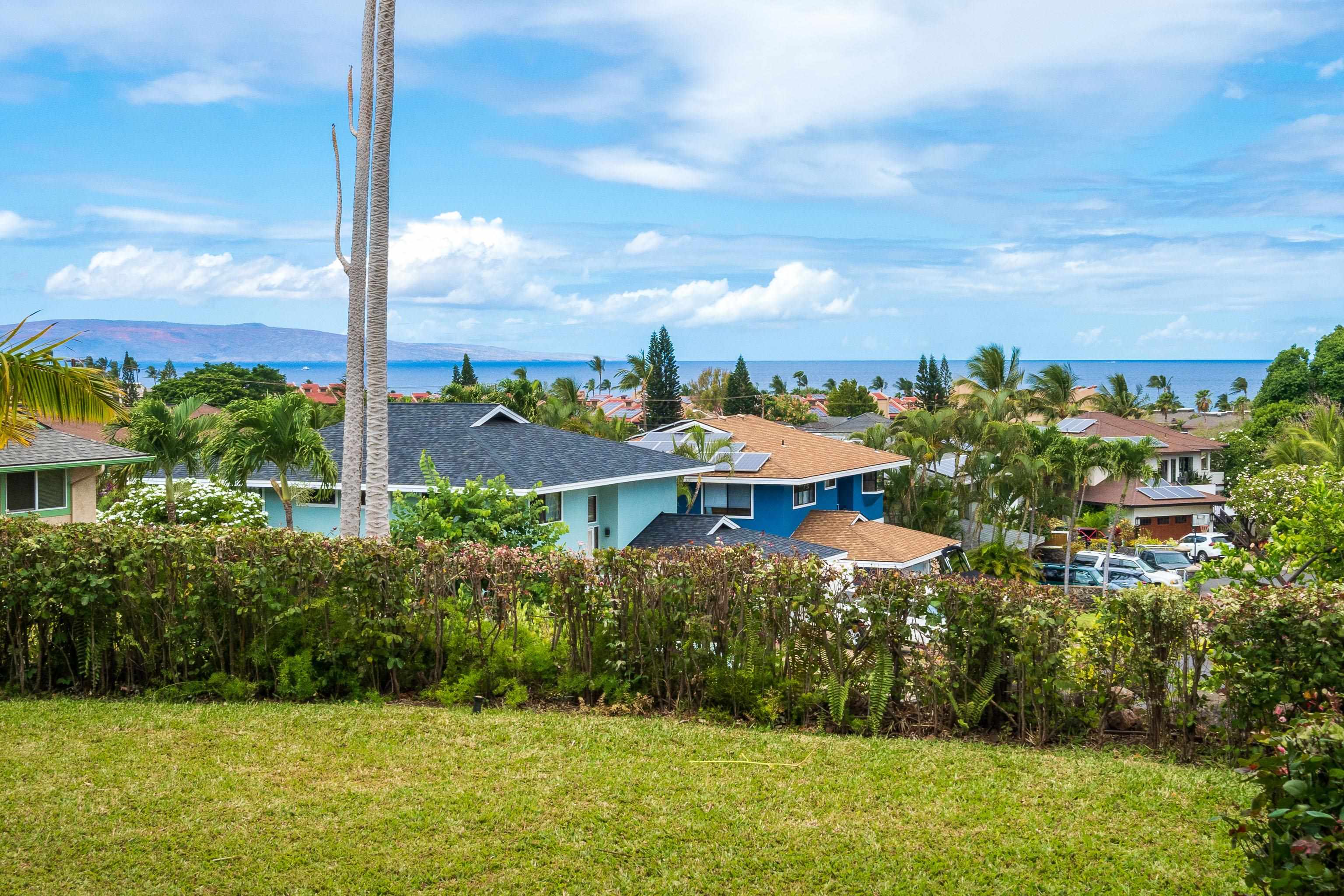 216 Kamakoi Loop Kihei, HI 96753 - Photo 10 of 30 a view of a lake with a garden