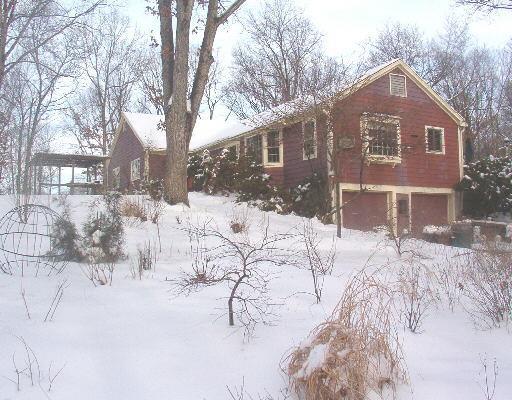 146 Hanover Road Newtown, CT 06470 - Photo 1 of 1 a front view of a house with a yard covered in snow