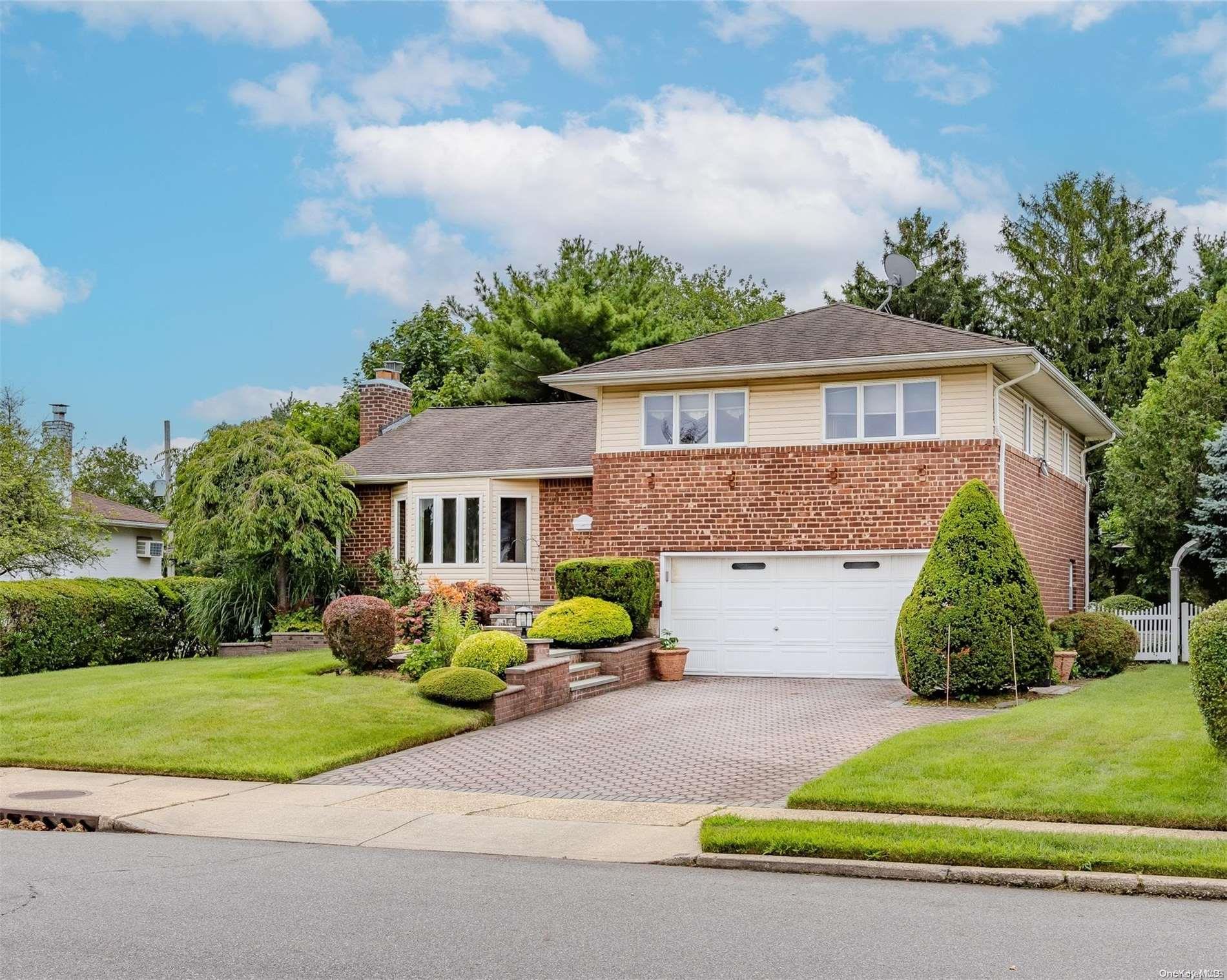 10 Henley Road Farmingdale, NY 11735 - Photo 1 of 1 a view of a house with a yard and large tree