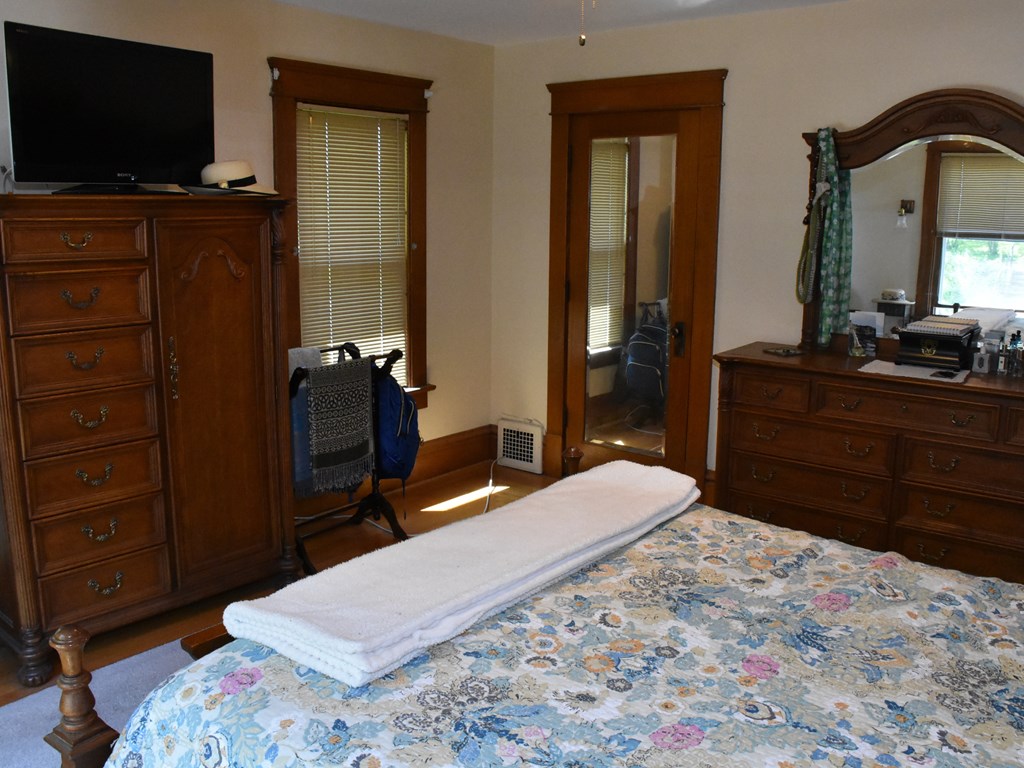 655 Chestnut Street Meadville, PA 16335 - Photo 25 of 43 a bedroom with a bed and wooden floor