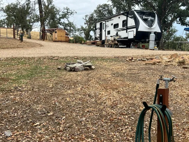 a front view of a house with a yard covered in snow