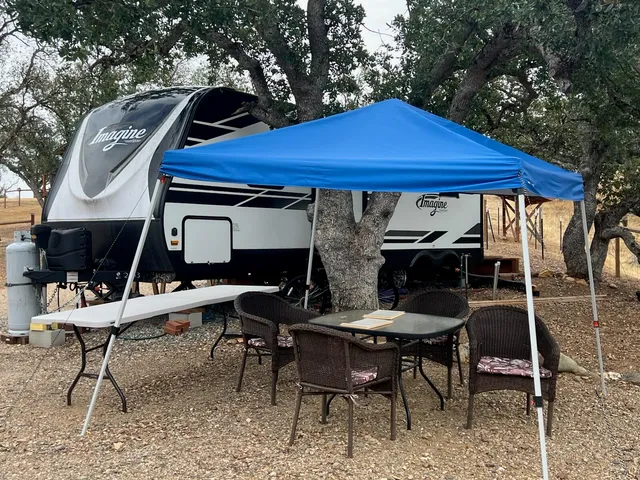 a view of a chairs and table in the patio