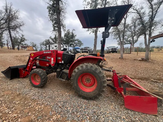 a view of a car is parked in a yard