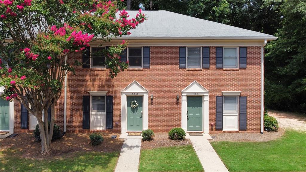 2952 Webb Bridge Road Alpharetta, GA 30009 - Photo 1 of 1 a front view of a house with a yard and potted plants