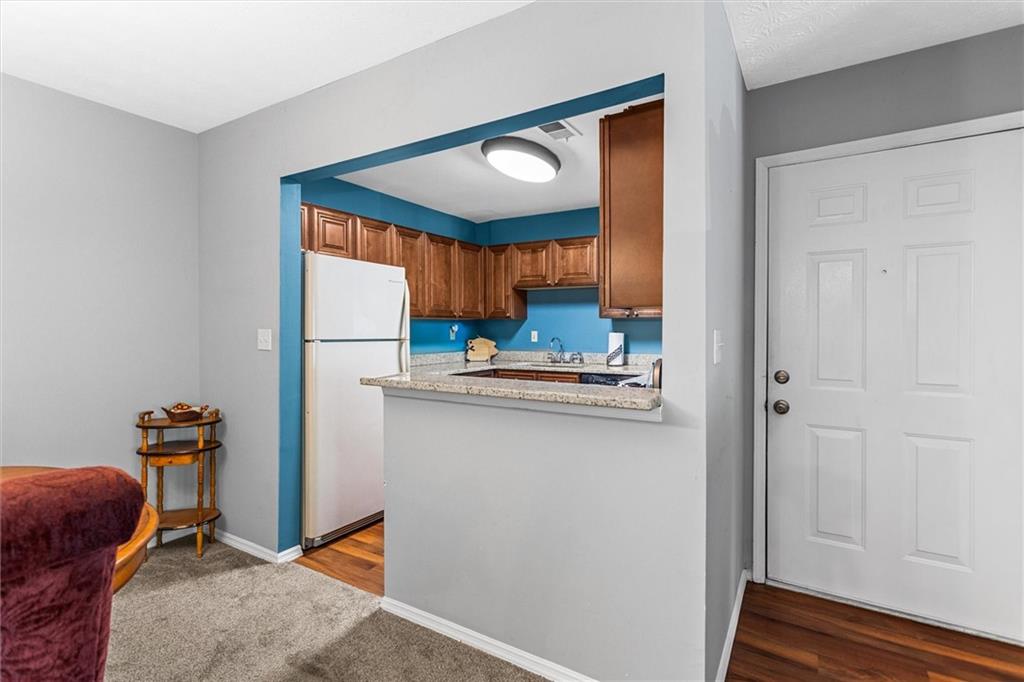 1610 Raleigh Circle Marietta, GA 30067 - Photo 16 of 33 a kitchen with sink refrigerator and microwave