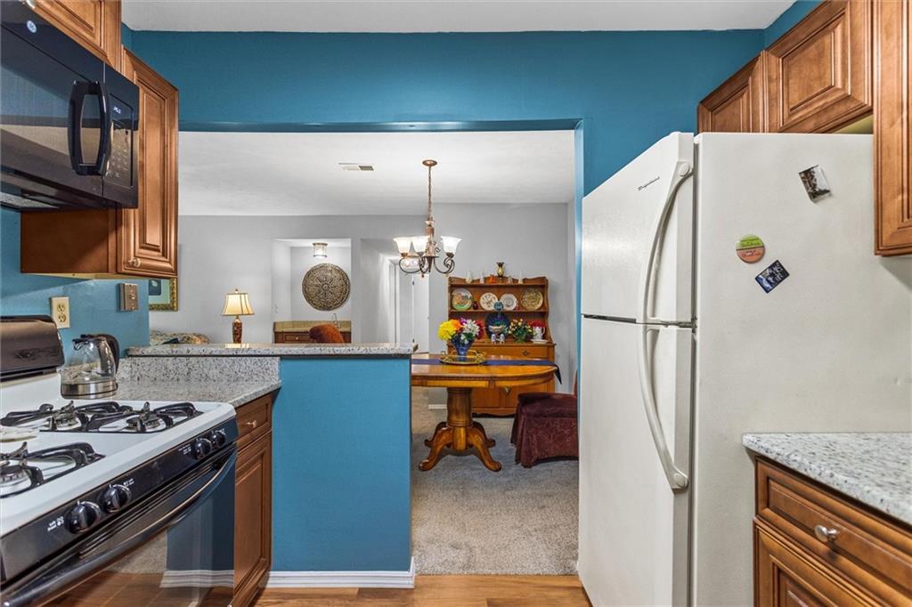 1610 Raleigh Circle Marietta, GA 30067 - Photo 17 of 33 a kitchen with a refrigerator and a stove