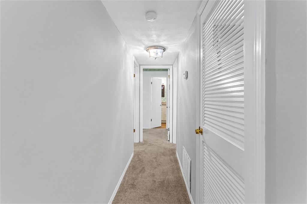 1610 Raleigh Circle Marietta, GA 30067 - Photo 18 of 33 a view of a hallway with wooden floor and closet